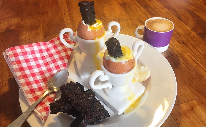 Boiled eggs with black pudding soldiers
